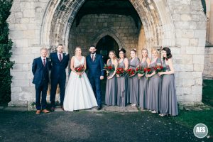Bridal party in archway at St Mary and Martins Church in Blyth