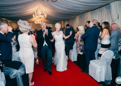Bride and Groom dancing down isle at Hotel Van Dyk, Derbyshire