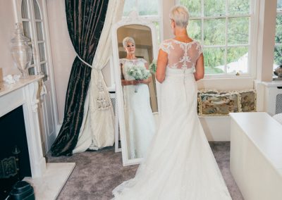Bride in bridal suite mirror at Hotel Van Dyk, Derbyshire