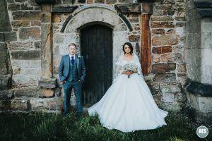 Bride and Groom in Church Doors at Laughton Church