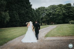 Bride and Groom walking photo at Red Brick House