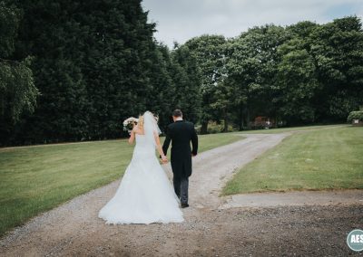 Bride and Groom walking photo at Red Brick House